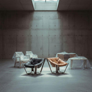 Black Cocoon Lounge Chair by BEACON, modern seating with a cozy, rounded design and smooth fabric upholstery.