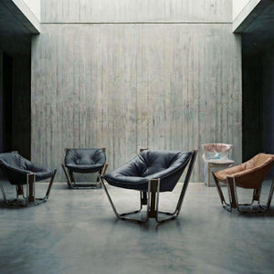 Black Cocoon Lounge Chair by BEACON with a cozy, rounded design, perfect for modern living spaces.