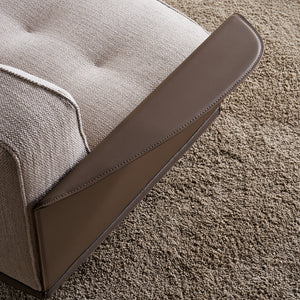A beige Avenor armchair display item with plush upholstery and wooden legs, showcasing a modern design by BEACON.