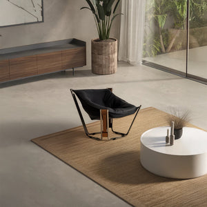 Black Cocoon Lounge Chair by BEACON, modern chair with rounded, cocoon-shaped design and plush seating for comfortable relaxation.