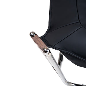 Black Cocoon Lounge Chair by BEACON, modern seating with a rounded, cocoon-inspired design for stylish comfort.