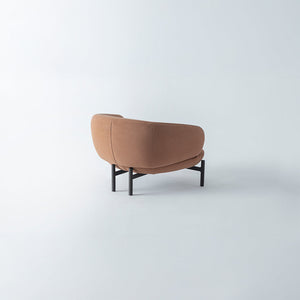 HOMAGE KOLTUK Freda armchair with plush upholstery and wooden legs, stylish modern seating for living room decor.