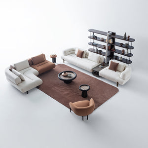 HOMAGE KOLTUK Freda armchair with plush fabric upholstery and modern design, featuring a comfortable cushioned seat and armrests.