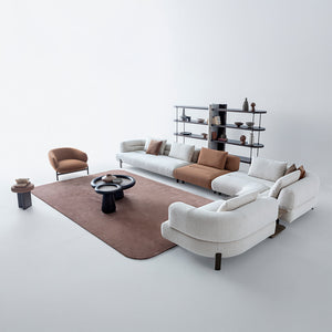 HOMAGE KOLTUK Freda armchair with plush fabric upholstery and modern design, shown in a cozy living room setting.