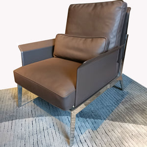 Modern BEACON lounge chair LC069 with a sleek design, featuring cushioned seat and backrest in a stylish living room setting.