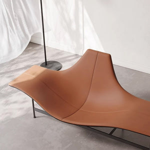 Maserati fiberglass matte caramel lounge chair by BEACON, modern design with smooth curves and plush upholstery.