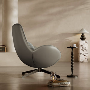 Beige Vigo swivel lounge chair by BEACON, featuring a modern design with a comfortable, padded seat and sleek metal base.