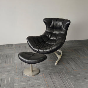 Vexel black lounge chair with matching ottoman by BEACON, modern design, upholstered seating and wooden legs.