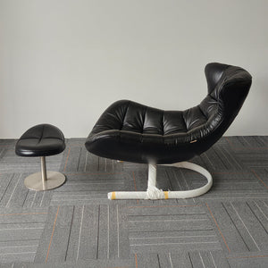 Vexel black lounge chair with matching ottoman by BEACON, modern design and comfortable seating for living rooms.