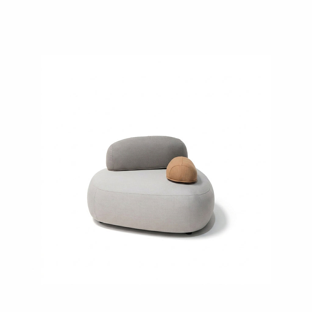 BEACON Cumulus lounge chair armchair with plush cushions, modern design, in a cozy living room setting.