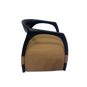 Elegant Dune armchair by BEACON featuring plush fabric upholstery and a modern design with wooden legs.