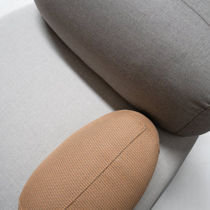 BEACON Cumulus lounge armchair with sleek design, featuring plush cushions and modern style in a cozy living space.