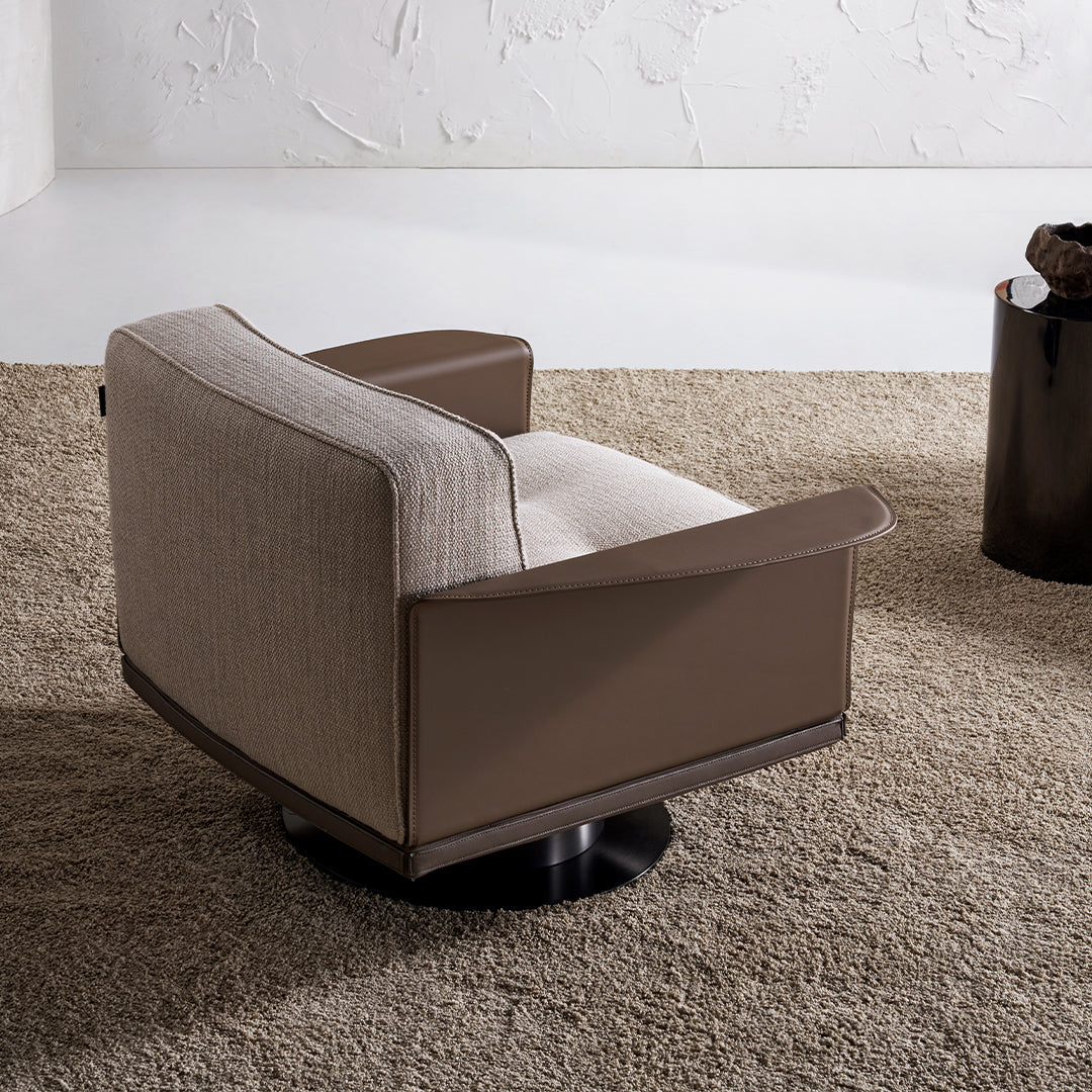 A beige Avenor armchair by Beacon, displayed as a showroom item with plush fabric and modern design.