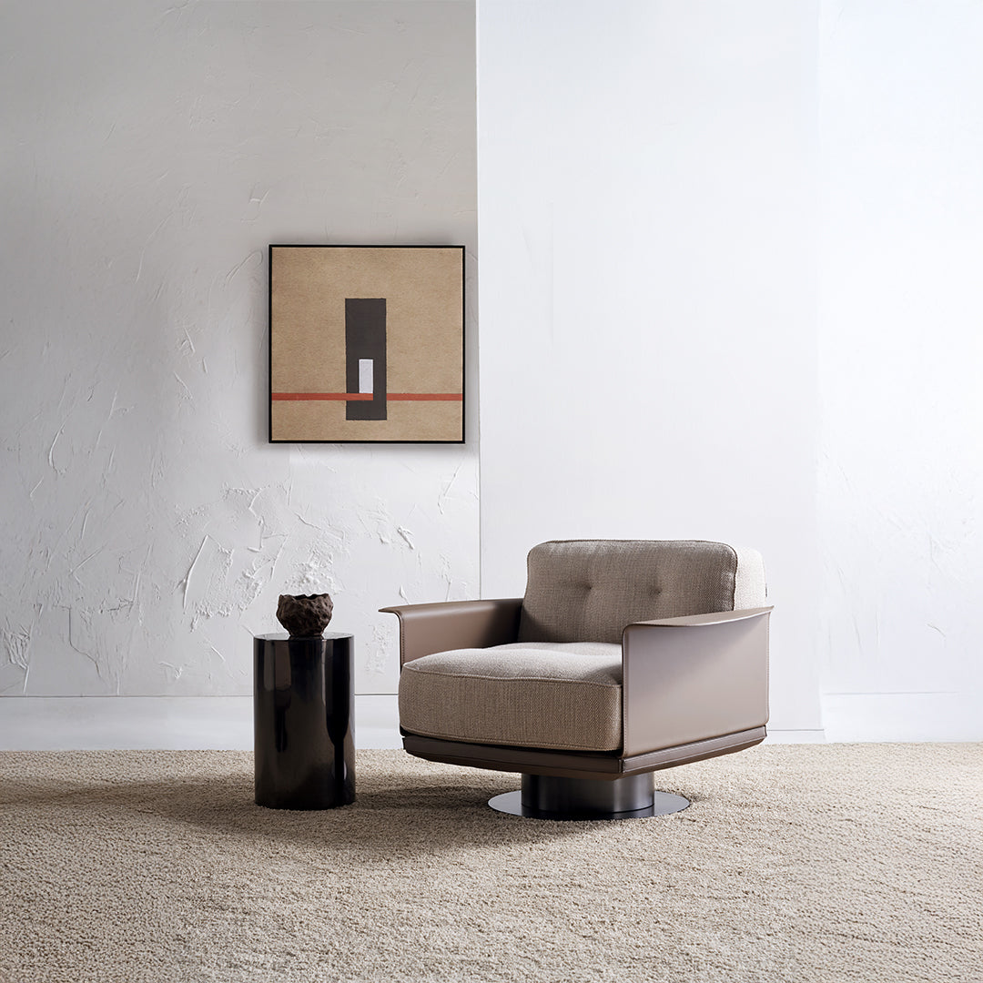 A beige Avenor armchair by BEACON, displayed as a showroom item, with plush fabric upholstery and modern design.