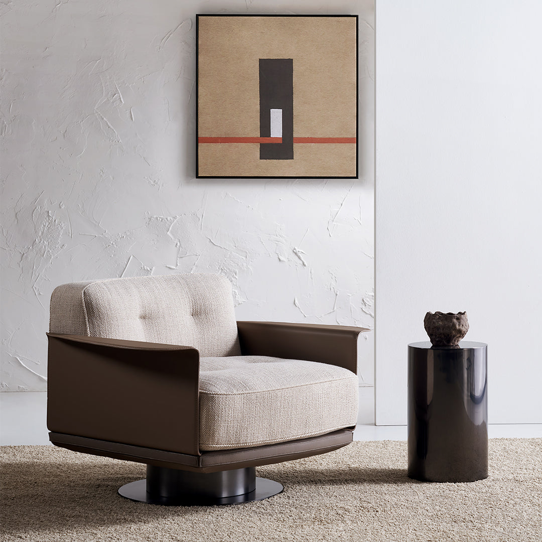 A beige Avenor armchair display model from BEACON, featuring plush upholstery and modern design, shown from a side view.