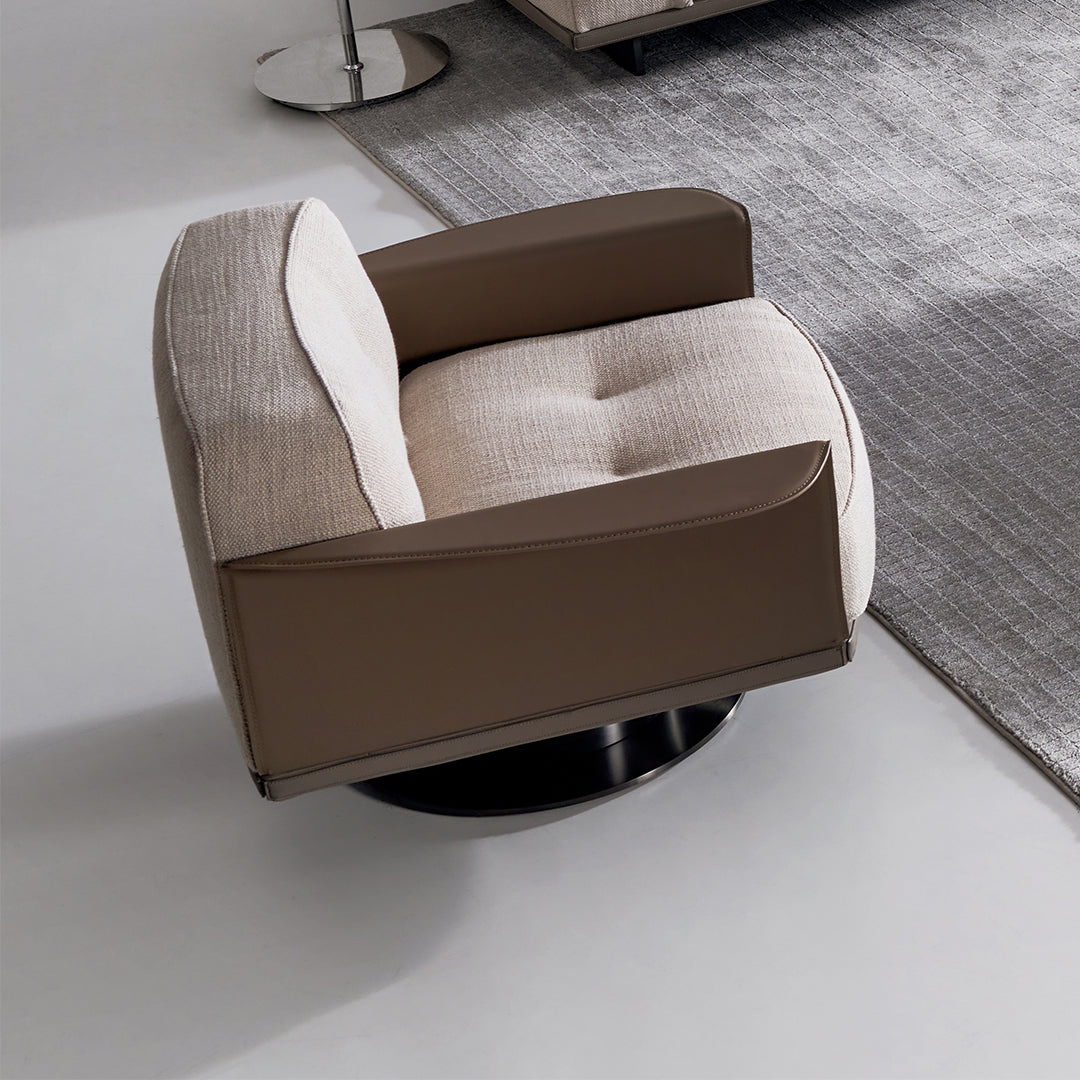 A beige BEACON Avenor armchair display model with plush fabric and rounded armrests, showcasing modern living room style.