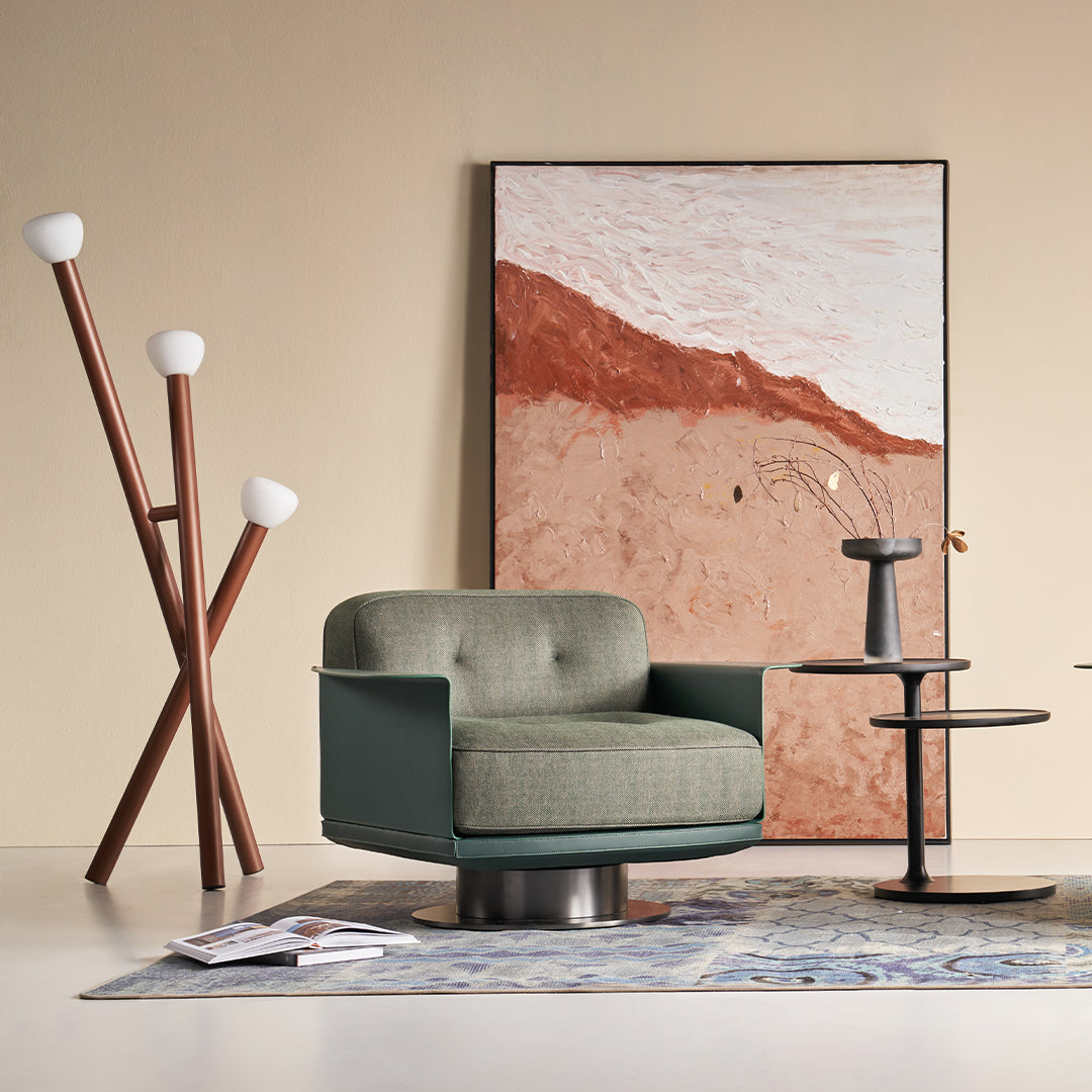 Green Avenor armchair from BEACON with plush fabric and modern design, ideal for living room or lounge area.