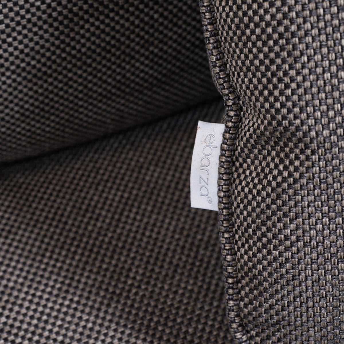 Beacon Clogs lounge chair with seat and back cushions, modern armchair with plush upholstery and stylish design.