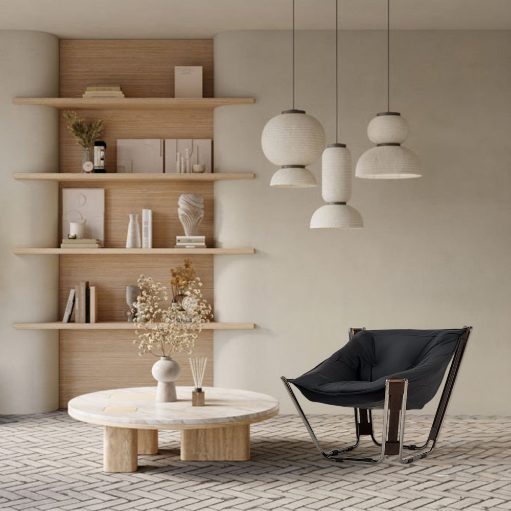 Black Cocoon Lounge Chair by BEACON, modern design with plush, rounded shape, perfect for relaxing in stylish spaces.