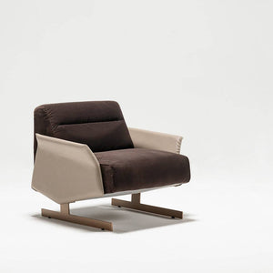 HOMAGE KOLTUK Edessa Armchair with plush fabric upholstery, modern design, and sturdy wooden legs.