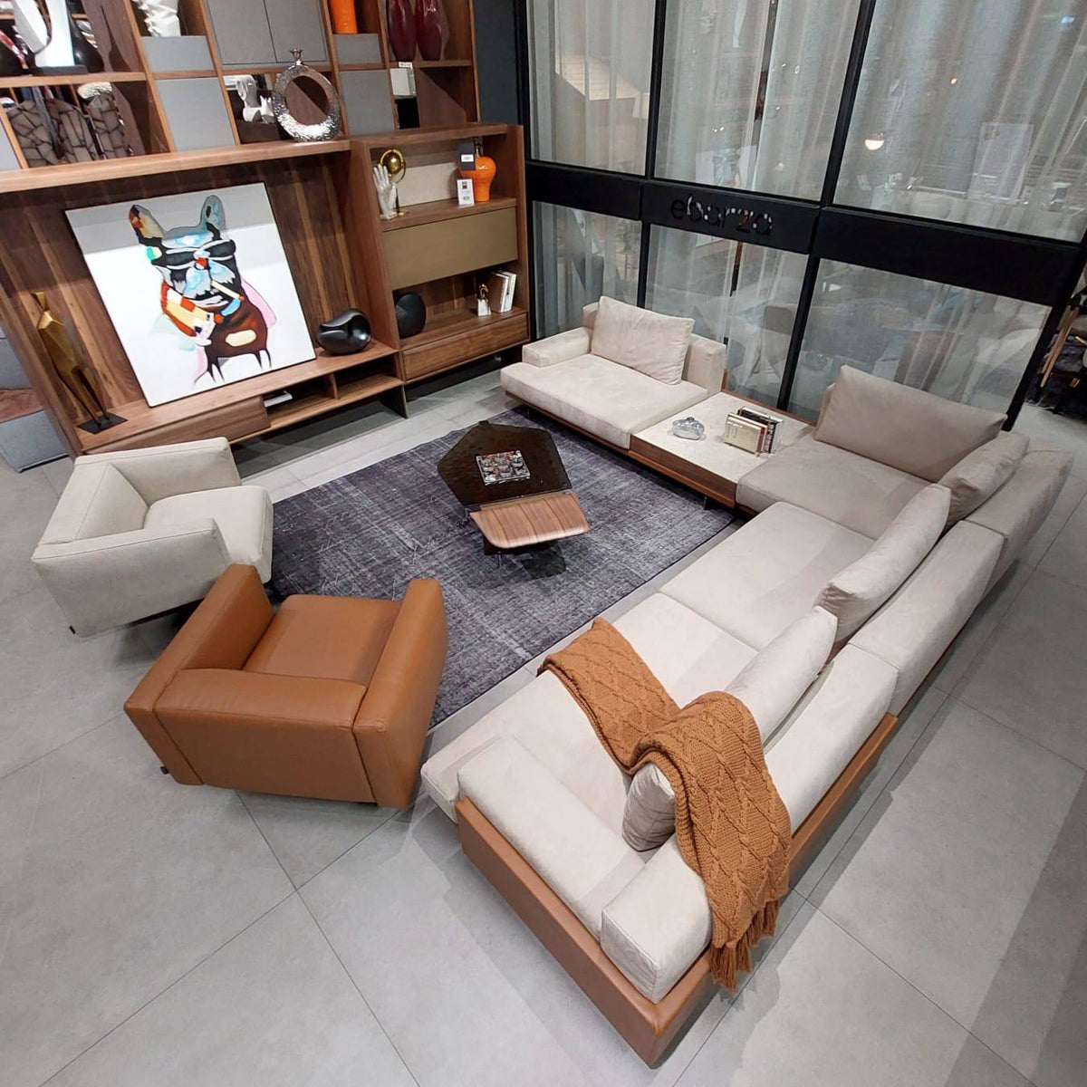 Beige Era Armchair by HOMAGE KOLTUK with plush upholstery and modern design, shown from a side angle.