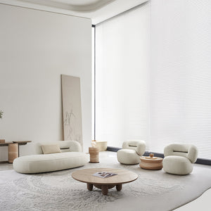 BEACON Ferrara armchair AMCJ-DY6057 with plush fabric upholstery and modern design, shown in a cozy living room setting.