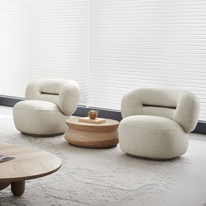 BEACON Ferrara armchair AMCJ-DY6057 with plush fabric upholstery and modern design, shown in a cozy living room setting.