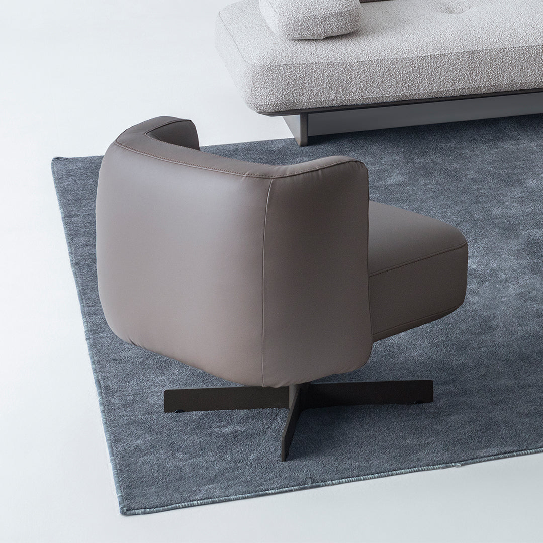 Foresta armchair by HOMAGE KOLTUK with wooden legs and plush fabric upholstery, modern design for living room decor.