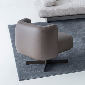 Foresta armchair by HOMAGE KOLTUK with wooden legs and plush fabric upholstery, modern design for living room decor.