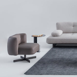 HOMAGE KOLTUK Foresta armchair with plush fabric upholstery, modern design, and wooden legs.