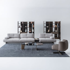 Foresta Armchair by HOMAGE KOLTUK featuring plush fabric, modern design, and wooden legs for stylish comfort.
