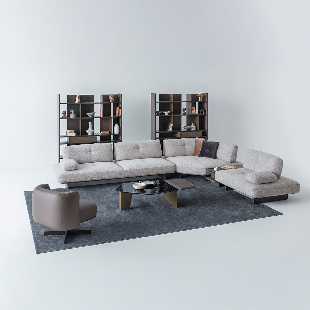 Foresta armchair from HOMAGE KOLTUK featuring a modern design with soft fabric upholstery and wooden legs.