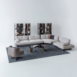 Foresta armchair from HOMAGE KOLTUK featuring a modern design with soft fabric upholstery and wooden legs.