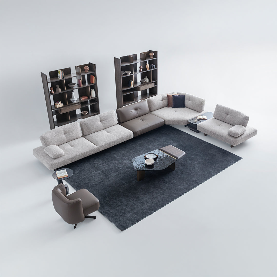 Foresta armchair by HOMAGE KOLTUK featuring a modern design, upholstered in soft fabric with wooden legs.