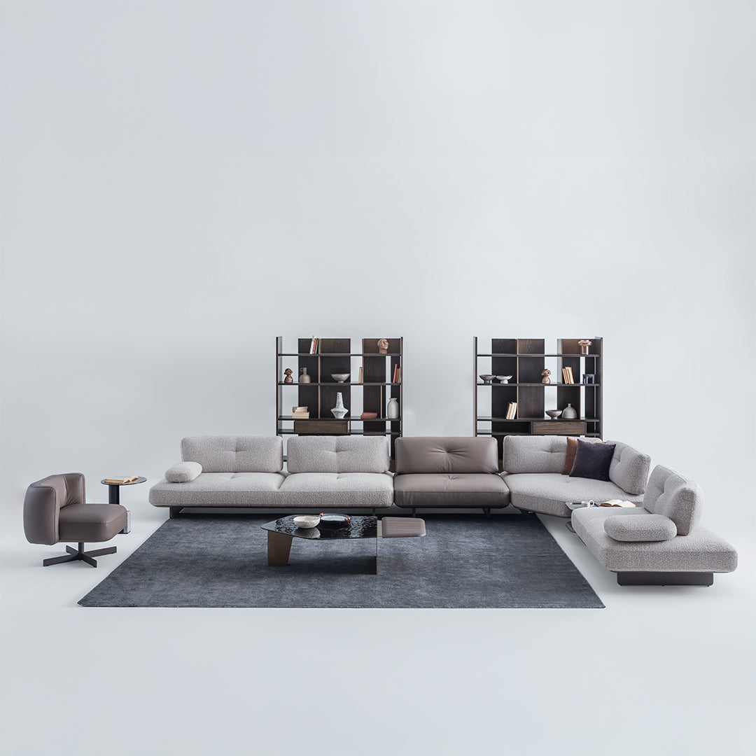 Foresta armchair by HOMAGE KOLTUK featuring a modern design with soft upholstery and wooden legs.