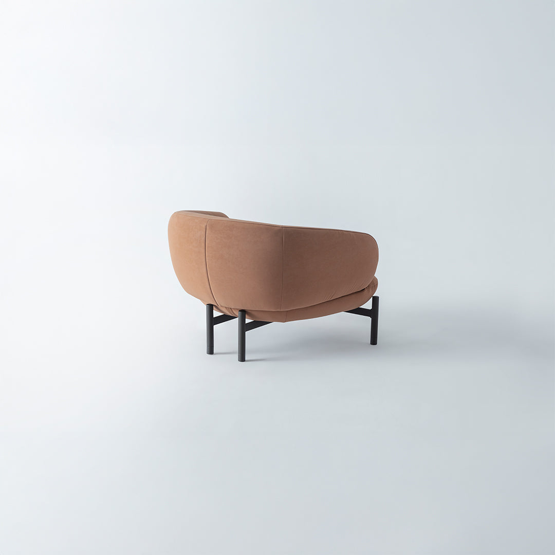 HOMAGE KOLTUK Freda armchair with plush upholstery and wooden legs, stylish modern seating for living room decor.
