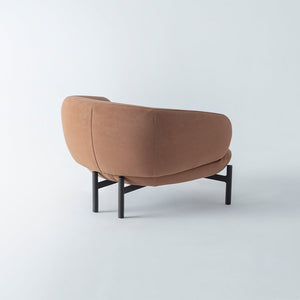 HOMAGE KOLTUK Freda armchair with plush fabric upholstery and modern design, shown in a cozy living room setting.