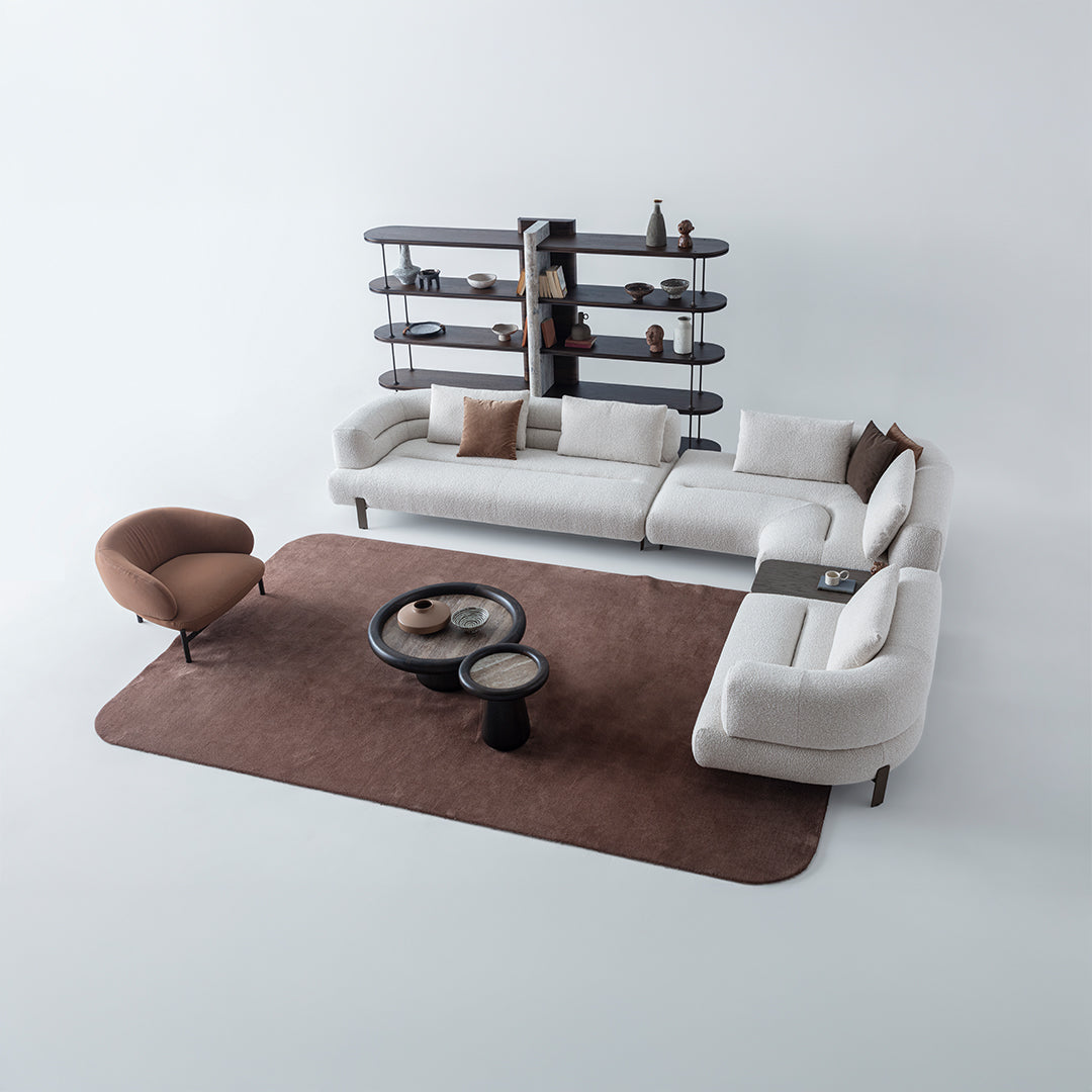 HOMAGE KOLTUK Freda armchair with plush fabric upholstery and wooden legs, modern design, seen from front view.