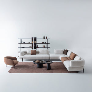 Freda armchair by HOMAGE KOLTUK featuring plush fabric upholstery and a modern design for comfortable seating.