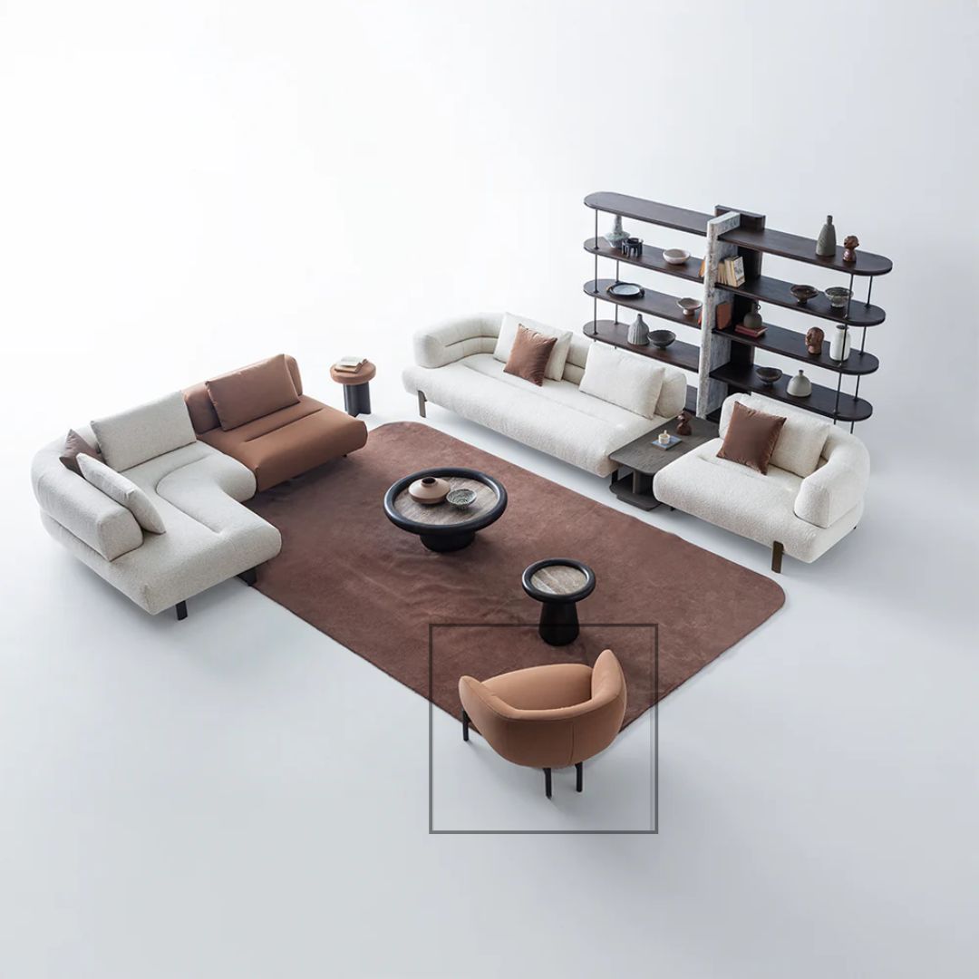 HOMAGE KOLTUK Freda armchair with plush fabric upholstery and modern design, shown in a cozy living room setting.