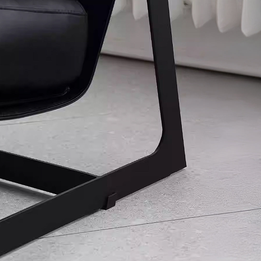 Black Lille Lounge Chair LC008 from BEACON featuring a modern, minimalist design with cushioned upholstery and sleek legs.