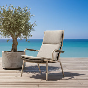 BEACON Loop Highback Outdoor Lounge Armchair with curved backrest and armrests, suitable for outdoor relaxation.
