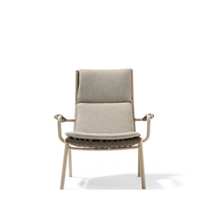 BEACON LOOP highback outdoor lounge armchair with cushioned seat and backrest, suitable for patio or garden relaxation.