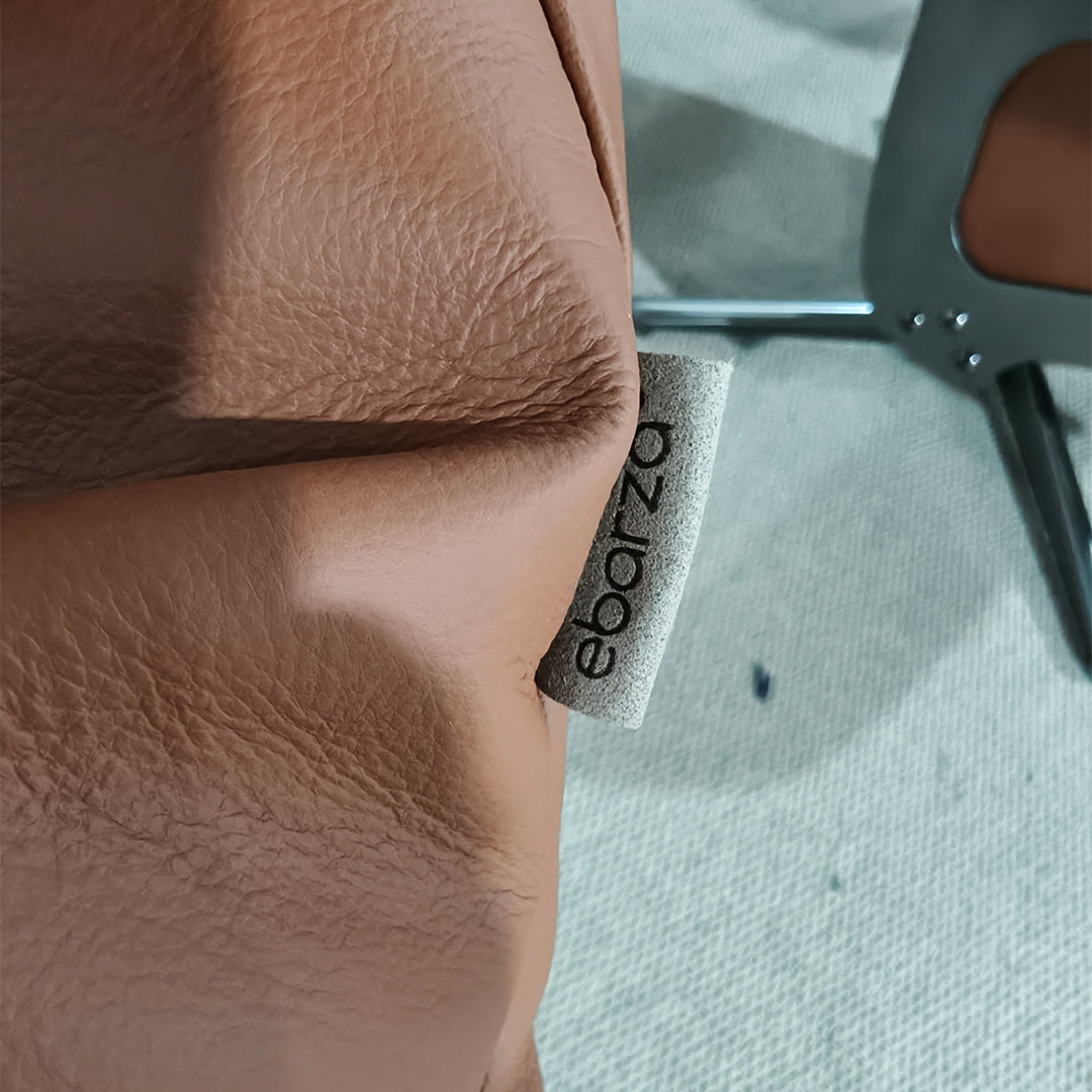BEACON Meridian lounge chair with matching caramel leather ottoman, stylish and comfortable for modern living spaces.