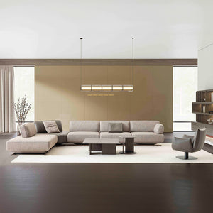 YOL LIVING MILA Amara armchair with plush fabric upholstery and modern design, shown in a cozy living room setting.
