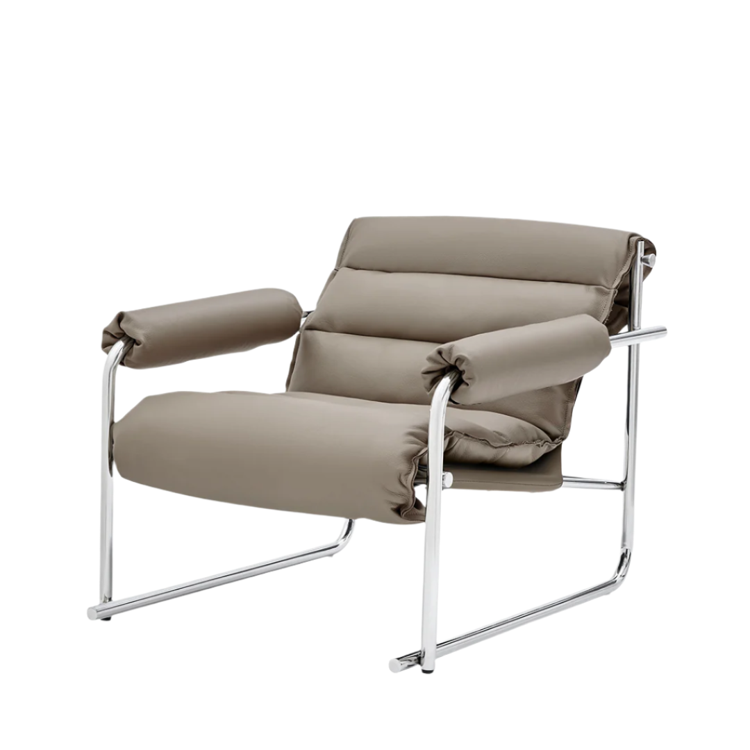 Beige Murcia leather lounge chair by BEACON with plush cushioning and modern design, perfect for living room relaxation.