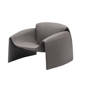 Grey Drancy armchair by BEACON, showcasing plush upholstery and modern design in a comfortable living room setting.