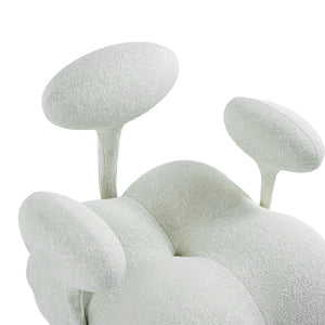 Beige and white Nodus lounge chair by BEACON, featuring modern design and cushioned seating for comfortable relaxation.