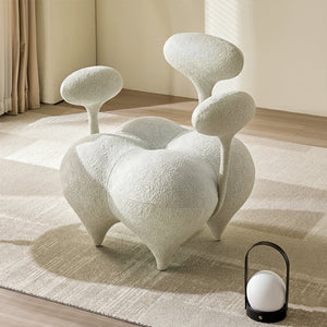 Beige and white Nodus lounge chair by BEACON with sleek modern design and plush cushioned seat for comfortable seating.