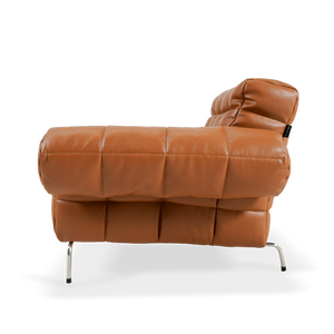 Yabo Lounge Chair LC077 by BEACON, in orange, showcasing modern design and comfortable seating for stylish living spaces.